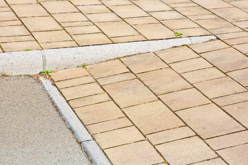 Flooring with inclined ramp in outdoors public space for overcom