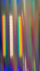high res full frame macro photo of round abstract pastel iridescent holographic foil background...