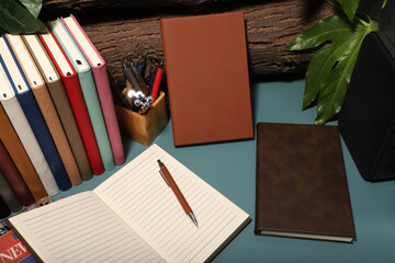 Leather Journals and Notebooks in different colors. Concept shot, top view. Custom background...