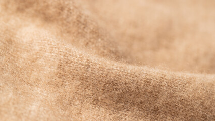 Beige luxury natural cashmere. Blurred background with copy space