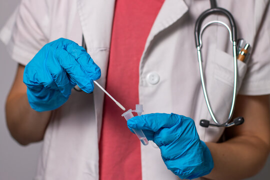 Doctor in a hospital using rapid antigen test kit for self test COVID-19 pandemic. COVID-19 coronavirus pandemic protection concept.