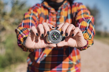 Close-up Of A Woman's Hands Holding A Compass. Travel Concept. Copy Space