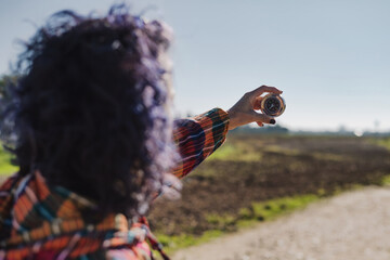 Woman With Compass In Hand On Nature Road. Travel Concept. Landscape