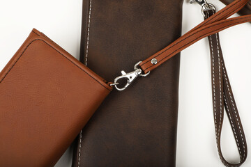 Women's leather wallets in brown colors. Concept shot, top view. Custom background women's leather...