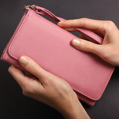 Women's leather wallets in pink colors. Concept shot, top view. Custom background women's leather wallets view. Beautiful modern women's leather wallets