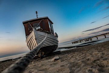 Boat on the Baltic Sea beach in the evening