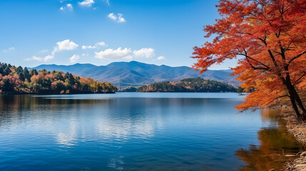 Beautiful autumn landscape with a lake and mountains in the background.