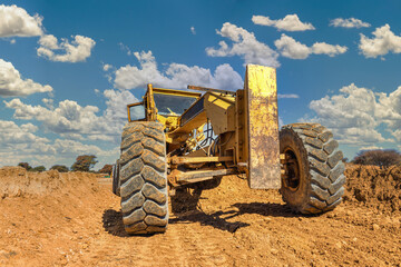 grader working on a construction site, perspective view
