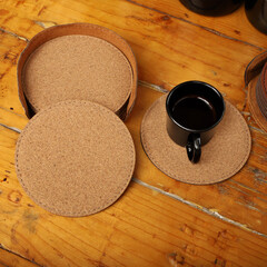 Obraz na płótnie Canvas Leather table mats in different colors. Concept shot, top view. Custom background view of leather table coaster. Stitched and leather table coaster