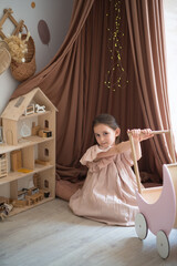 girl with wings plays with a doll house © Маргарита Медведева