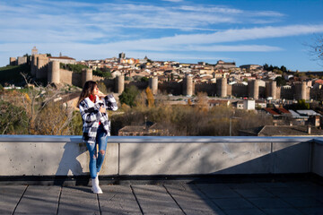 Casual traveler, gazing at Avila's beauty.