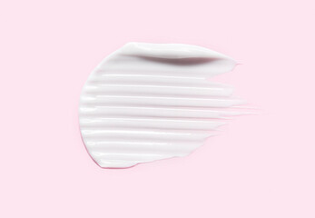 Cream cosmetic anti aging  texture brush stroke isolated on pink background. Hyaluronic acid skincare moisturizer product - obrazy, fototapety, plakaty