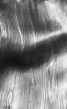 Silver metallic shimmering glossy nail polish composition background. Cosmetic makeup product texture