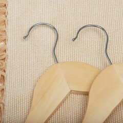 Wooden clothes hangers. Concept shot, top view. Custom background, view of wooden clothes hangers.
