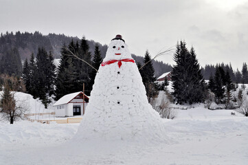 Large snowman in Comandau village, Romania
