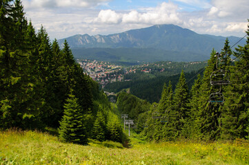 Fototapeta na wymiar Predeal, a mountain resort town in Romania and the Postavarul massif.