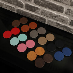 Leather Round pocket makeup mirror in different colors. Concept shot, top view. Custom background, pocket makeup mirror. Travel pocket mirror, free space for text.