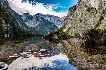 Fototapeta na wymiar Quiet mountain lake surrounded by high mountains