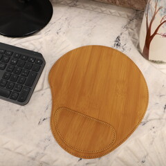 Leather mousepads in bamboo colors. Concept shot, top view. Custom white marble background, leather mousepad. Free space for text.