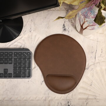 Leather mousepads in dark brown colors. Concept shot, top view. Custom background, leather mousepad. Free space for text.