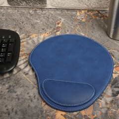 Leather mousepads in blue colors. Concept shot, top view. Custom background, leather mousepad. Free...