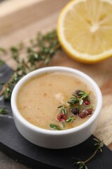 Delicious turkey gravy, thyme and peppercorns on board, closeup