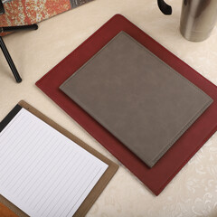 Leather portfolio. Concept shot, top view, portfolio in different colors and leather pen. Custom background flap portfolio view. Portfolio and accessories.