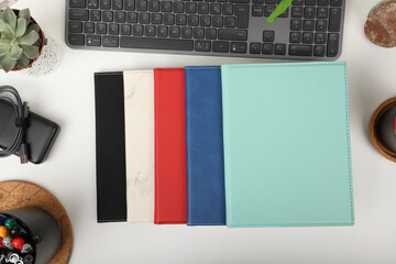 Leather portfolio. Concept shot, top view, portfolio in different colors and leather pen. Custom...