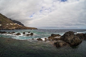 The rocky shore and natural pools of El Caleton. Garachico. Tenerife. Canary islands. Spain.