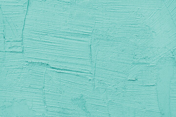 Vintage, old stucco plaster surface background, close up grunge texture of turquoise painted cement, concrete wall texture. Wallpaper, backdrop, architecture design element