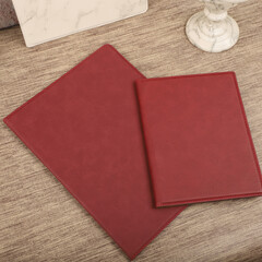 Leather portfolio. Concept shot, top view, portfolio in different colors and leather pen. Custom background flap portfolio view. Portfolio and accessories.