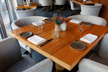 standard dining table set up for the restaurant with wooden furniture