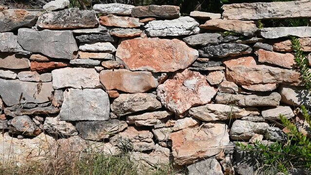 Dry stone wall, close up. Stone wall near the house in countryside. A traditional dry stone wall.