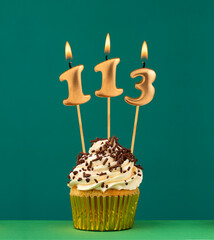 Birthday card with candle number 113 - Green background