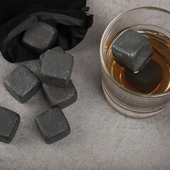 Whiskey cooler set gray soapstone stones close up. Concept shot, top view. Cooling cube whiskey...
