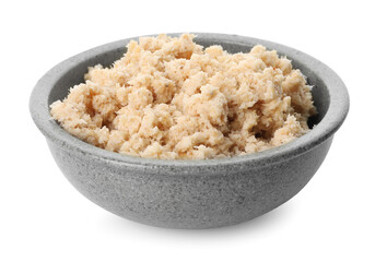 Bowl of tasty prepared horseradish isolated on white