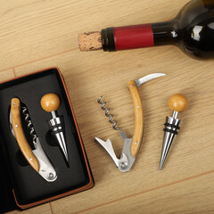 Wine opener set in leather box. Colorful leather boxes. Wine opener and cork. Close-up, top view,...