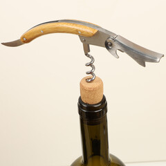 Wine opener set in leather box. Colorful leather boxes. Wine opener and cork. Close-up, top view,...