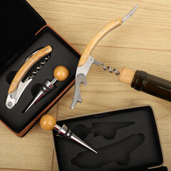 Wine opener set in leather box. Colorful leather boxes. Wine opener and cork. Close-up, top view,...