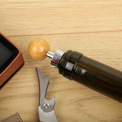 Wine opener set in leather box. Colorful leather boxes. Wine opener and cork. Close-up, top view,...