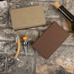 Wine opener set in leather box. Colorful leather boxes. Wine opener and cork. Close-up, top view,...
