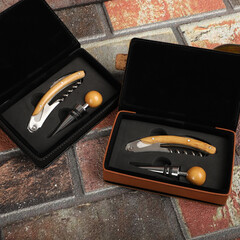 Wine opener set in leather box. Colorful leather boxes. Wine opener and cork. Close-up, top view,...