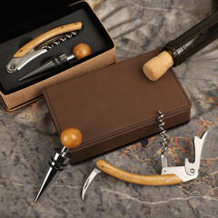 Wine opener set in leather box. Colorful leather boxes. Wine opener and cork. Close-up, top view,...