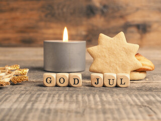 Scandinavian Merry Christmas with wooden blocks and the inscrption God Jul