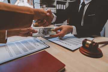 Businessmen shake hands and give bribes to lawyers to help them win court cases. The concept of bribery and bribes Fraud and Fraud. - obrazy, fototapety, plakaty