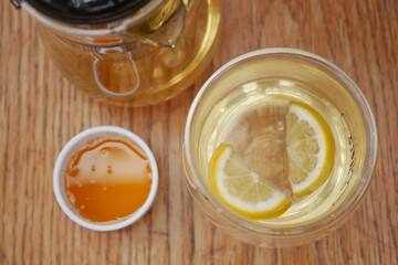 lemon tea and honey on table 