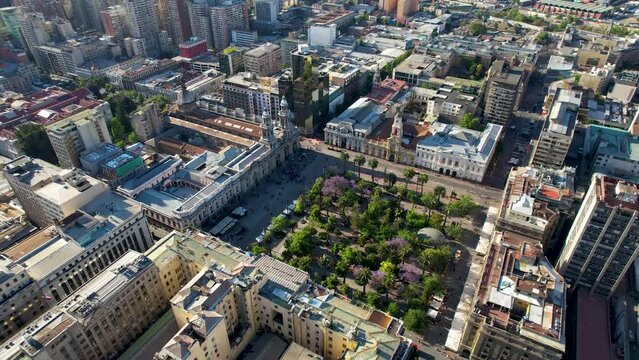 Beautiful aerial footage of the Plaza de Armas, Metropolitan Cathedral of Santiago de Chile, National History Museum of Chile, Central Market and the city of Santiago de  Chile