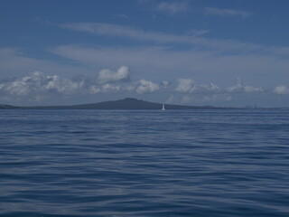 Sailing on calm waters at Rangitoto volcano island. Location: Auckland New Zealand