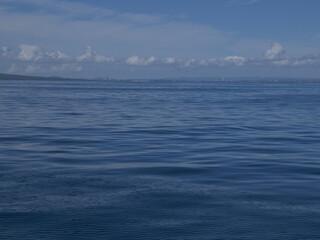 Sailing on calm waters of Hauraki Gulf towards Auckland CBD. Location: Auckland New Zealand