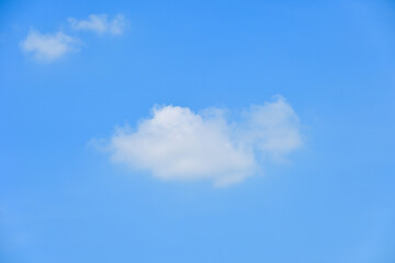 beautiful blue sky and white fluffy group of clouds with sunrise in the morning, natural background